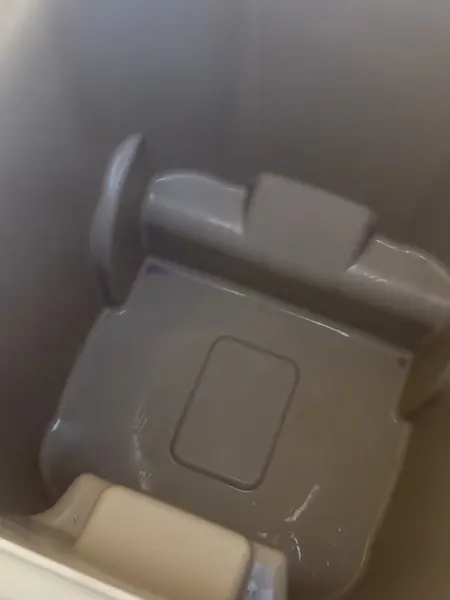 Tan trash bin, after